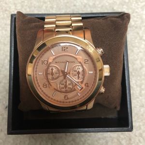Michael Korrs boyfriend rose-gold watch.